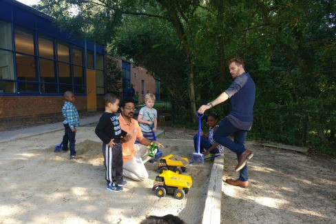Teachers and students on playground