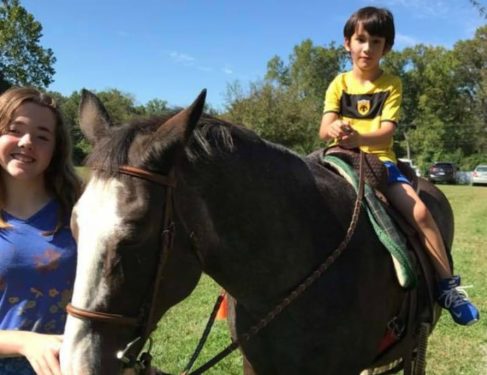 Child riding horse