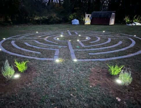 outdoor labyrinth at night with lights